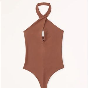 Can fit m/l but is medium on the tag brown body suit brand new condition